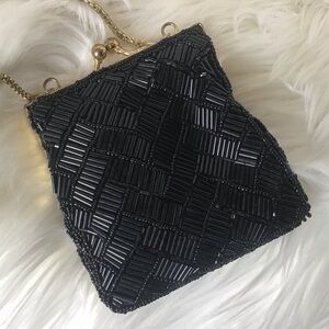 Black beaded Ladies Essentials mini purse with kiss closure and gold color chain